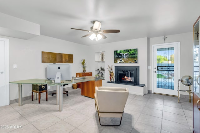 7763 W Libby St, Glendale, AZ 85308 - office space with ceiling fan, a glass covered fireplace, and light tile patterned floors
