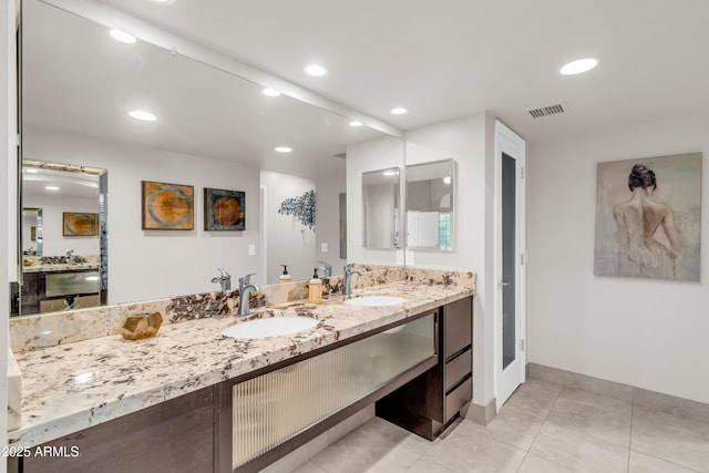7763 W Libby St, Glendale, AZ 85308 - bathroom featuring vanity, tile patterned flooring, visible vents, and recessed lighting