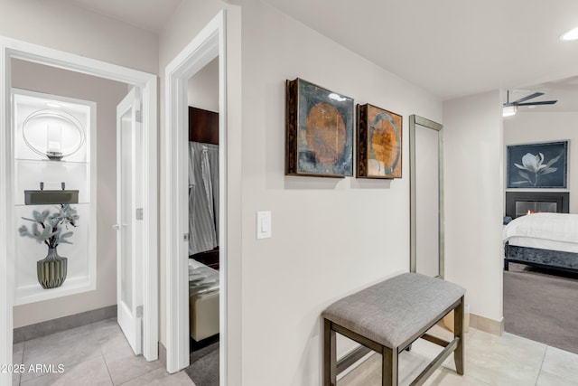 7763 W Libby St, Glendale, AZ 85308 - hallway with baseboards and light tile patterned floors