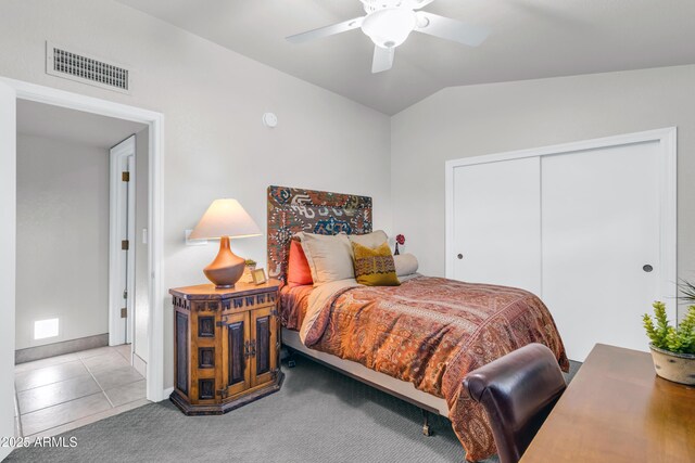 7763 W Libby St, Glendale, AZ 85308 - carpeted bedroom with vaulted ceiling, baseboards, visible vents, a closet, and ceiling fan