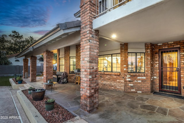 7763 W Libby St, Glendale, AZ 85308 - exterior entry at dusk with a patio area