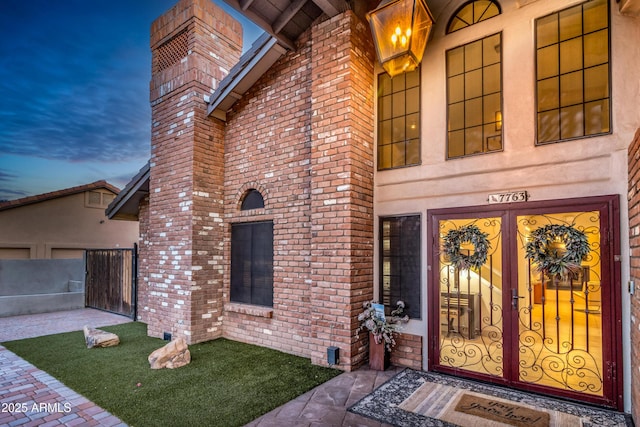 7763 W Libby St, Glendale, AZ 85308 - entrance to property featuring fence and brick siding