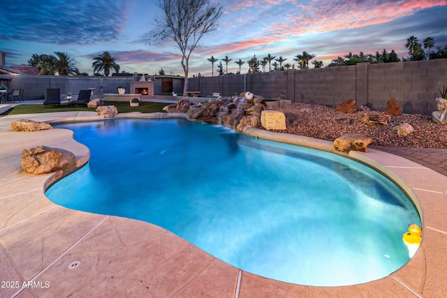 7763 W Libby St, Glendale, AZ 85308 - pool at dusk with a fenced backyard, a patio area, and a fenced in pool