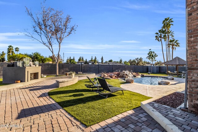 7763 W Libby St, Glendale, AZ 85308 - view of yard featuring a fenced backyard, a gazebo, a patio, and a fenced in pool