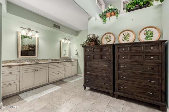 bathroom with vanity and tile patterned flooring