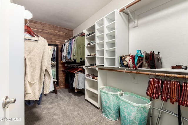 walk in closet with carpet floors