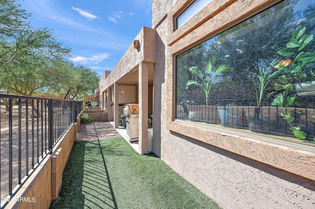 view of property exterior with a patio