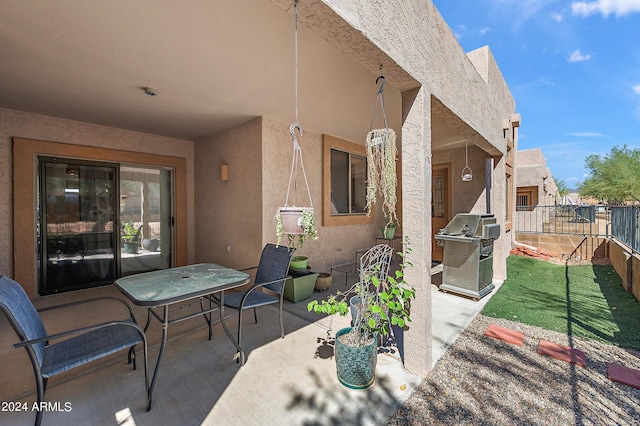 view of patio featuring a grill