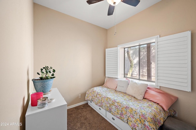 bedroom featuring dark colored carpet and ceiling fan