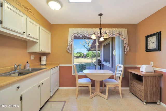 kitchen featuring sink, dishwasher, pendant lighting, light tile patterned floors, and an inviting chandelier