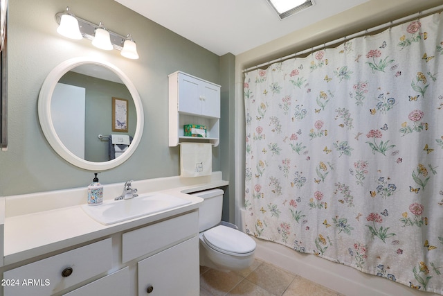 full bathroom with vanity, toilet, shower / bath combo with shower curtain, and tile patterned flooring