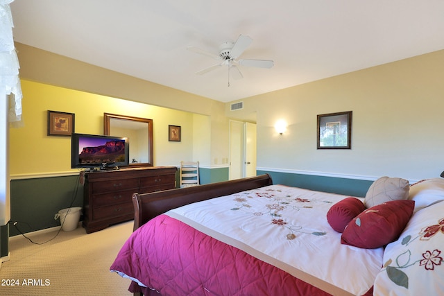 bedroom featuring light colored carpet and ceiling fan