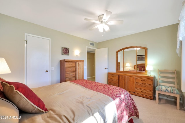 bedroom featuring ceiling fan and light colored carpet