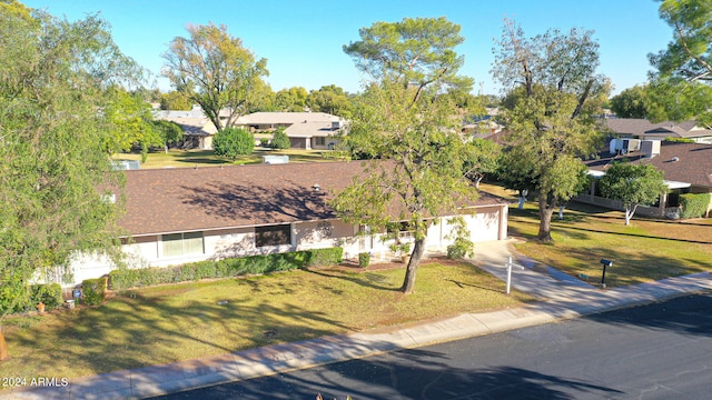 single story home featuring a front yard