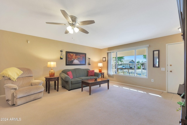 living room with light carpet and ceiling fan