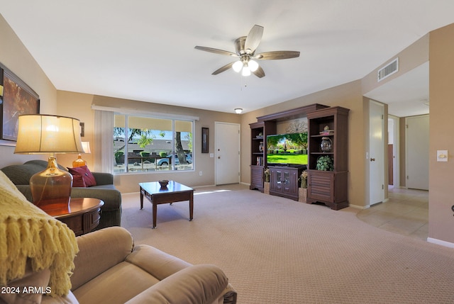 carpeted living room featuring ceiling fan