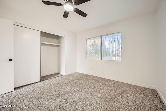 unfurnished bedroom featuring a closet, ceiling fan, and carpet floors