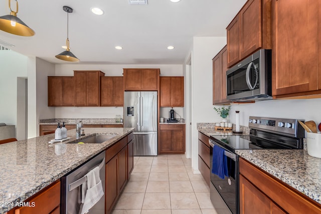 kitchen with light stone countertops, light tile patterned flooring, stainless steel appliances, and hanging light fixtures