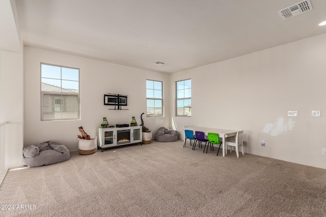 playroom featuring light carpet