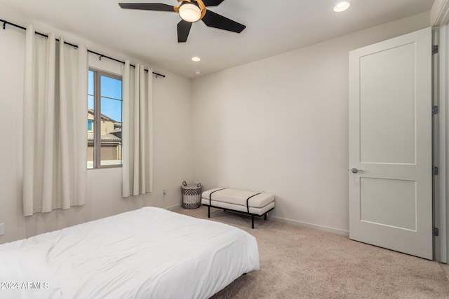 carpeted bedroom with ceiling fan