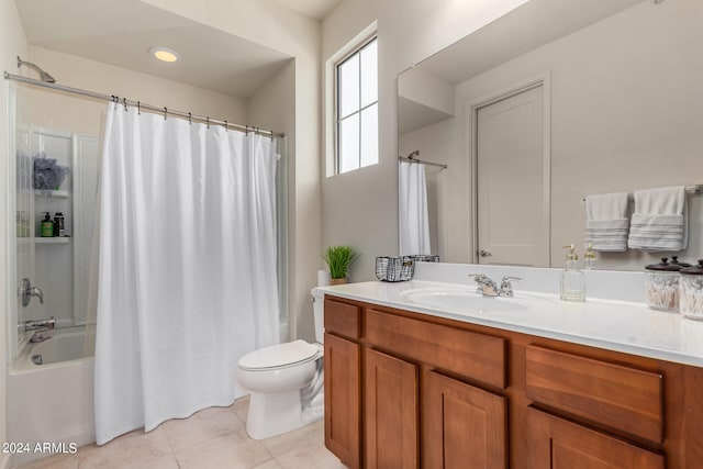 full bathroom featuring tile patterned flooring, shower / tub combo, vanity, and toilet