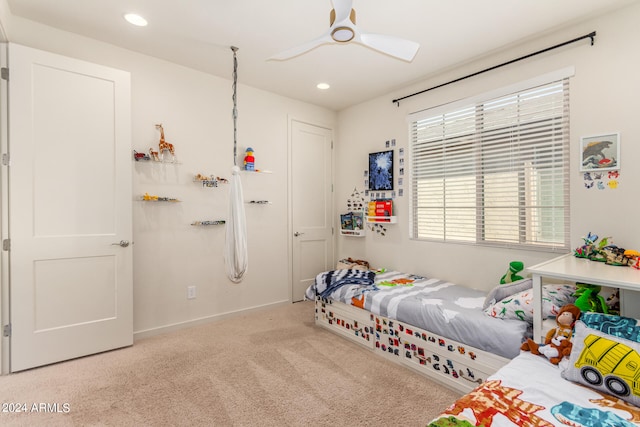 carpeted bedroom with ceiling fan