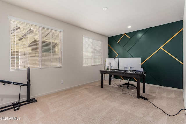 carpeted home office with plenty of natural light