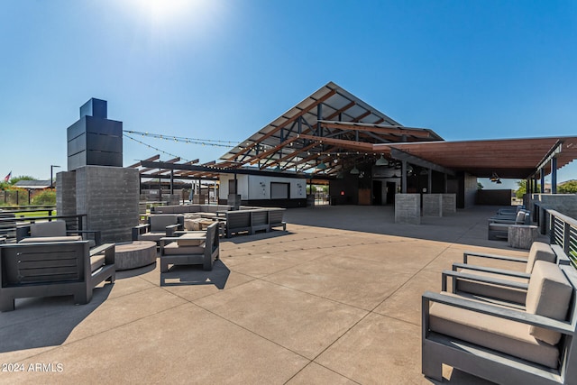 view of patio featuring an outdoor living space and a pergola