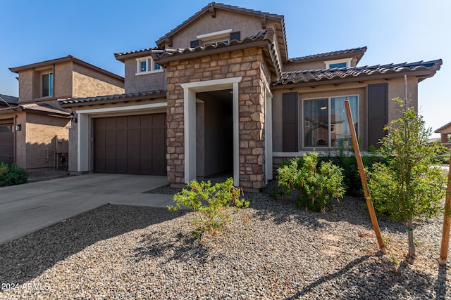 view of front of home with a garage