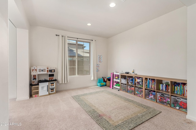 game room featuring light colored carpet