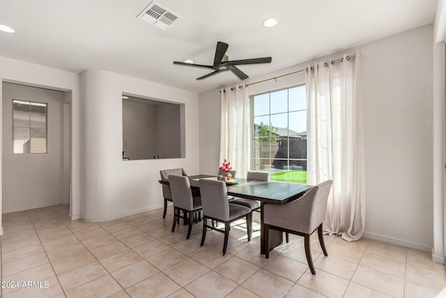 tiled dining room with ceiling fan