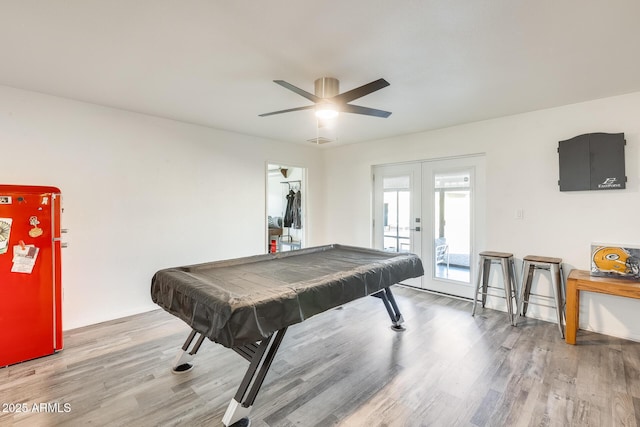 game room with wood-type flooring, billiards, ceiling fan, and french doors