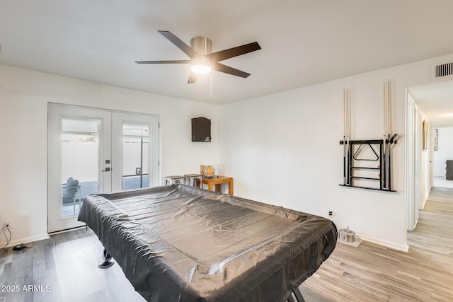 recreation room featuring french doors, billiards, and light hardwood / wood-style flooring