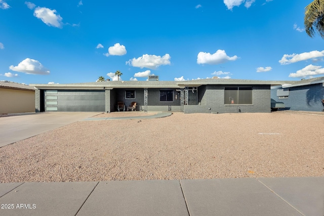 ranch-style house featuring a garage