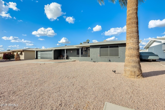 ranch-style home featuring a garage