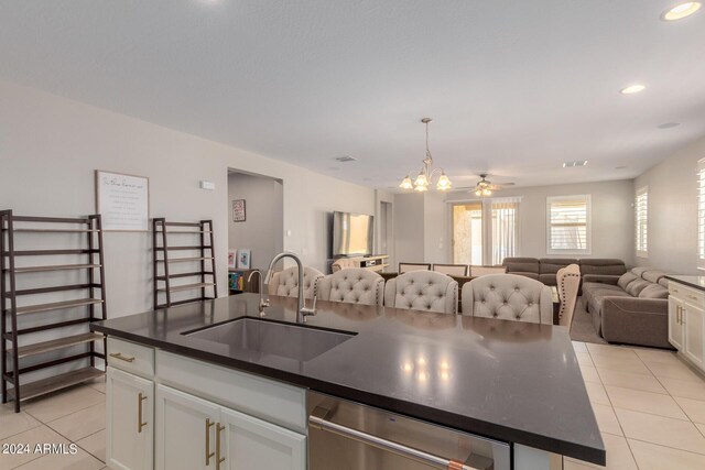 kitchen featuring white cabinetry, light tile patterned flooring, and stainless steel appliances