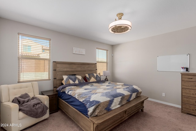 bedroom with light carpet