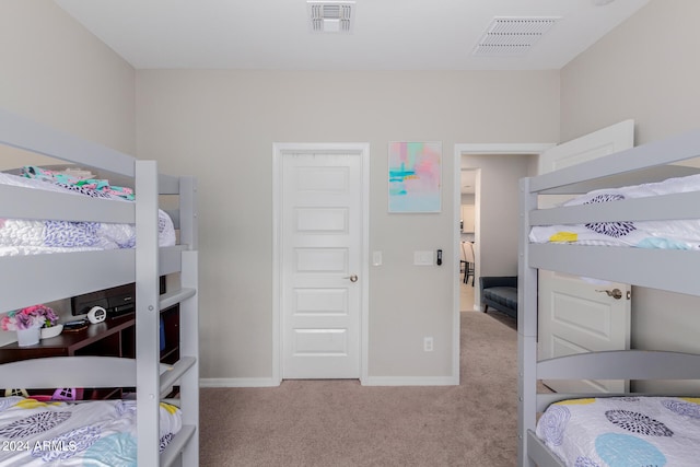 bedroom featuring light colored carpet