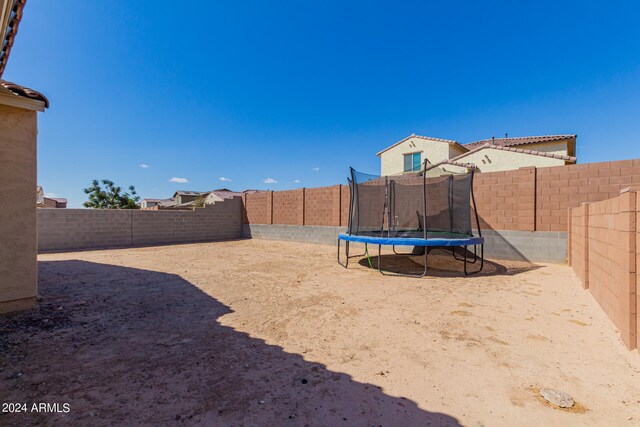 view of yard with a trampoline