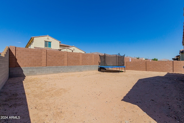 view of yard with a trampoline