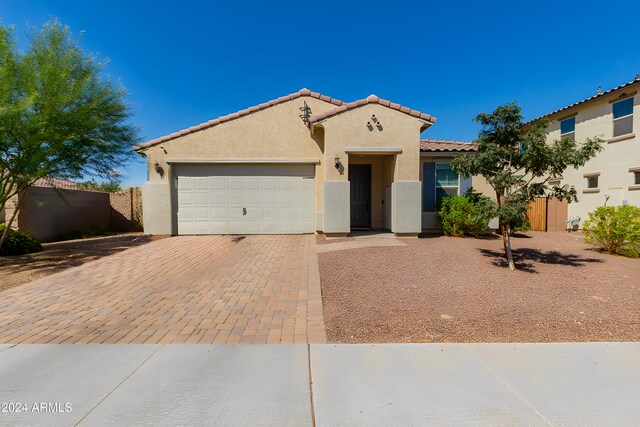 view of front of property with a garage