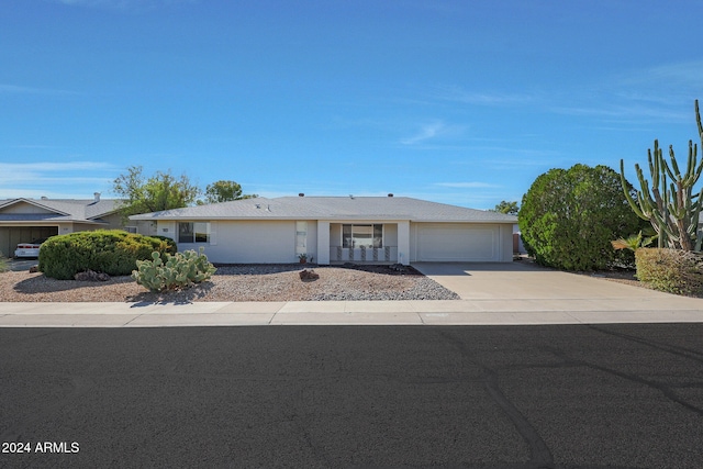 single story home featuring a garage