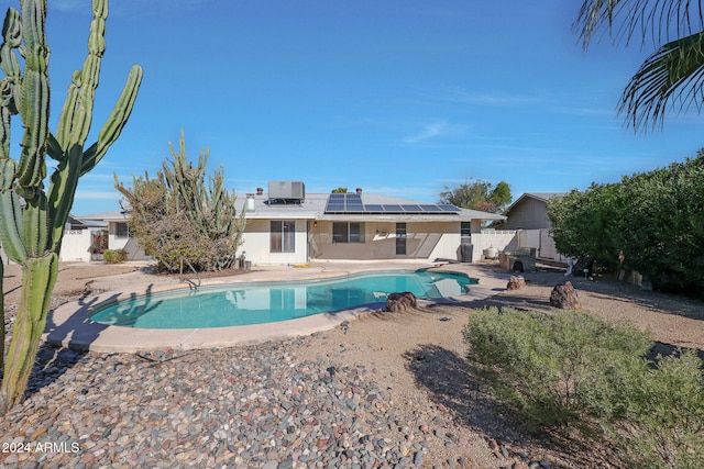 view of swimming pool featuring a diving board and a patio