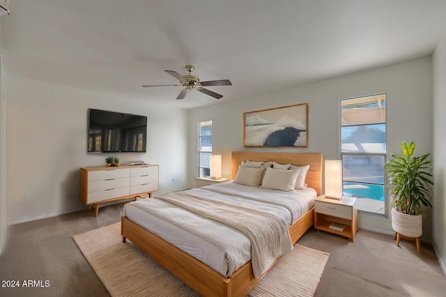 bedroom with multiple windows and ceiling fan