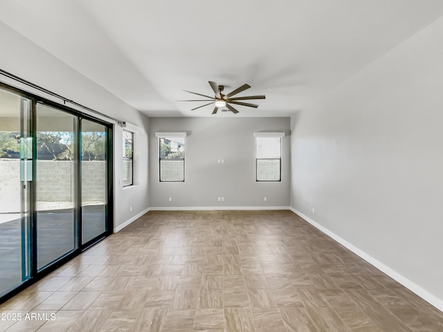 spare room featuring ceiling fan and light parquet flooring