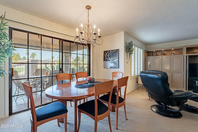 carpeted dining area featuring a textured ceiling and a notable chandelier