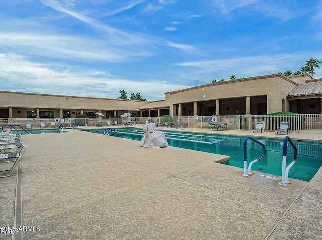 view of swimming pool featuring a patio