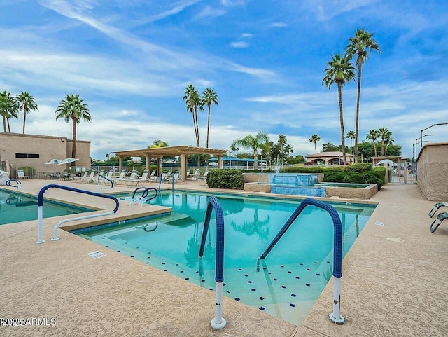 view of swimming pool with a pergola and a patio