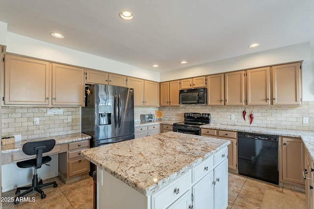 kitchen featuring tasteful backsplash, light stone counters, a kitchen island, and black appliances