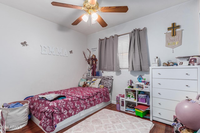 bedroom featuring wood finished floors and a ceiling fan